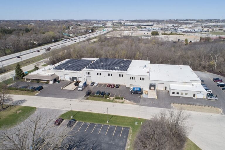 Commercial facility with rooftop solar panels.